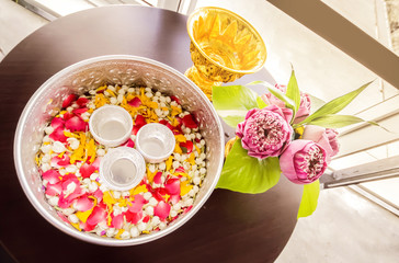 jasmine garland and jasmine and rose leaf in bowl for bless adults, Thai traditional for Mother's day and Father's day in thailand.