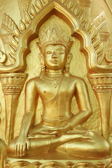 Buddha gold statue on golden background patterns.