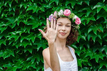 proud and happy girl shows a bridal ring