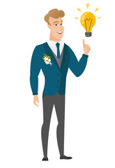 Groom pointing at business idea light bulb.