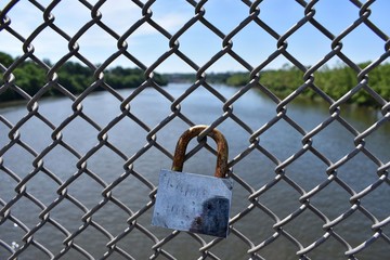A Lock A Fence And A Landscape 