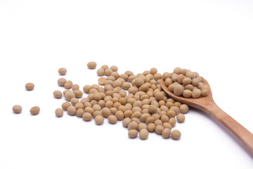 Soy beans on white background high protein Close-up Selective focus seeds Soya bean pulses in a wooden spoon