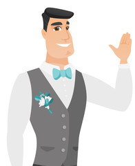 Young caucasian groom waving his hand.