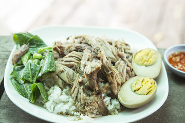 Stewed pork leg on rice in street food ,Thailand.