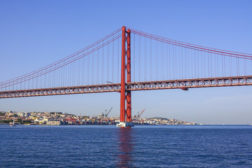 Fototapeta na wymiar Famous 25th April Bridge over River Tajo in Lisbon aka Salazar Bridge