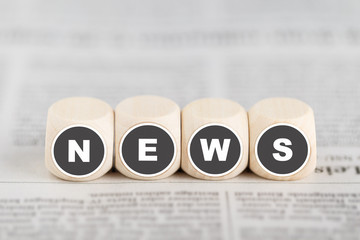 W&uuml;rfel bilden das Wort "News"