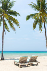 Obraz na płótnie Canvas Beach chairs on the white sand beach