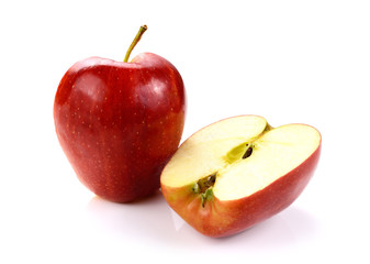 Red apple with slice isolated on white