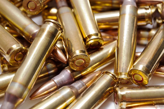A close up of loaded 223 brass ammo 