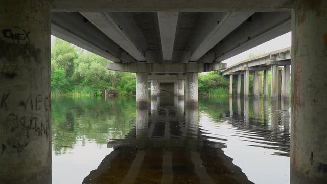 Birds fly under the bridge