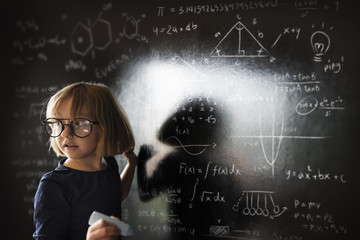 Little Girl Writing Blackboard Concept