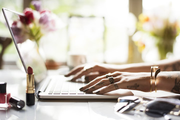 Woman Using Laptop Surfing Online Shop