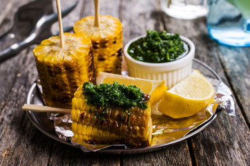 Grilled corn on sticks