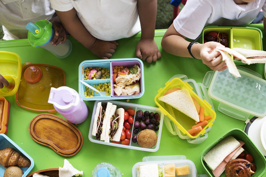 Group Of Kindergarten Students Eating Food Lunch Break Together