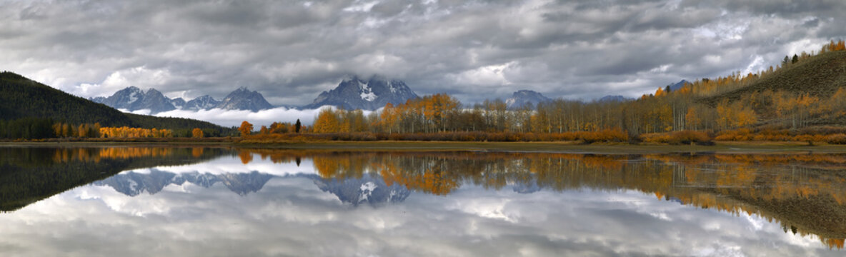 Panoramic image of Mt Moran on a fall morning relected on the Sanke river's Oxbow Bend
