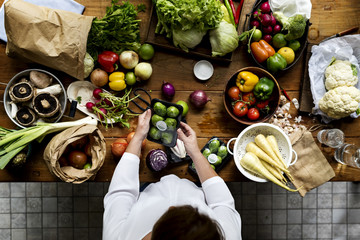 Aerial view of fresh organic various vegetable on wooden table - obrazy, fototapety, plakaty