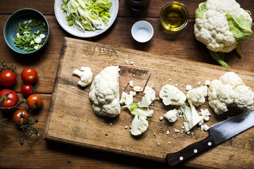 Aerial view of cauliflower on wooden cut board
