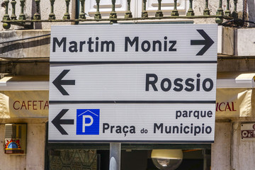 Direction signs in Lisbon leading to Rossio and Martim Moniz