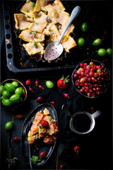 Patchwork  strawberry and gooseberry pie. dark photo