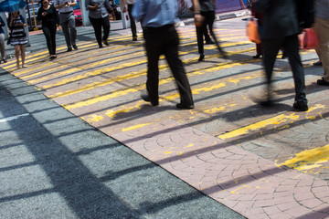 Motion Blur - People crossing the road. Blurry effect to illustrate movement