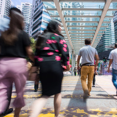 Motion Blur - People crossing the road. Blurry effect to illustrate movement