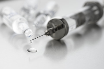 Syringe and ampules close-up