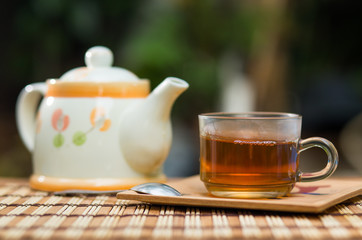 Teapot and hot tea on wooden table , Tea breaking time.