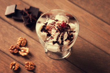 Ice cream sundae, chocolate pieces, walnuts and anise