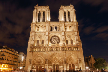 view on front side of Notre-Dame de Paris Cathedral at night
