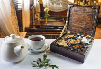 Teapot, cup and tea box
