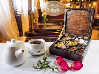 Teapot, cup and tea box
