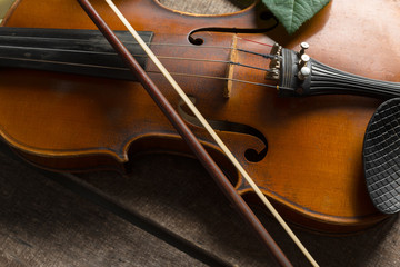 Violin on a wooden textured table