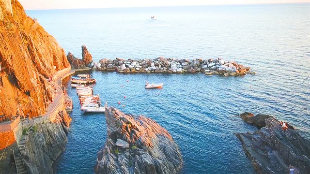 Beautiful cozy bay with boats and clear turquoise water in old village in Cinque Terre, Italy, Europe