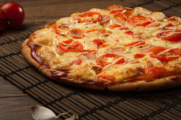 Delicious fresh pizza served on wooden table
