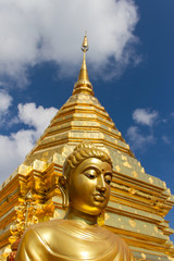 Naklejka premium Golden Buddha and golden stupa