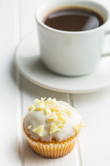 Tasty cupcake and coffee cup.