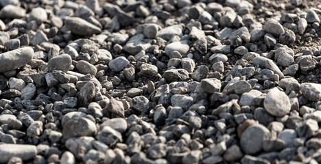 Crushed stone on the road as a background