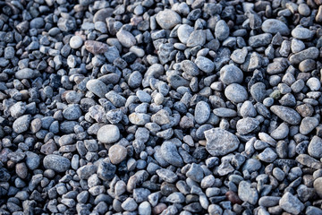 Crushed stone on the road as a background