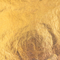 Gold foil leaf metallic wrapping paper texture background for wallpaper decoration element
