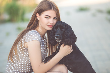 Closeup portrait of pretty young teen girl with cocker spaniel dog
