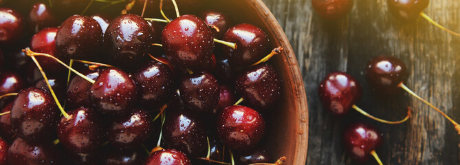 Cherries in a ceramic bowl on a table