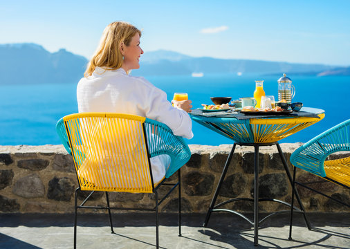 Woman enjoying summer morning on terrace