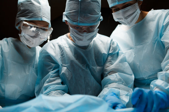 Doctors working in operating room