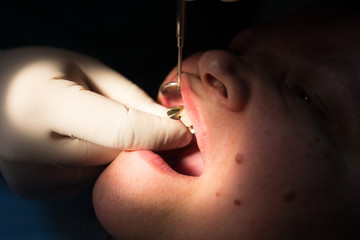 The dentist works with the client in the clinic