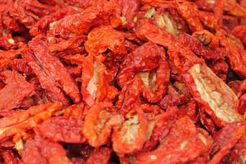 Dried Tomatoes for sale on a market. Dried Tomatoes background.