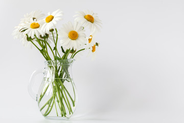Fototapeta na wymiar bouquet of field daisies in a vintage