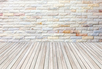 empty room with stone wall and wooden floor.