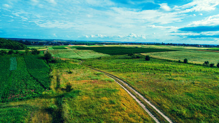 Fototapeta na wymiar drone with a camera on a green field.
