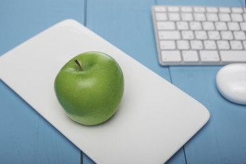 Fresh apple. Concept in style: Investing in computer technology.