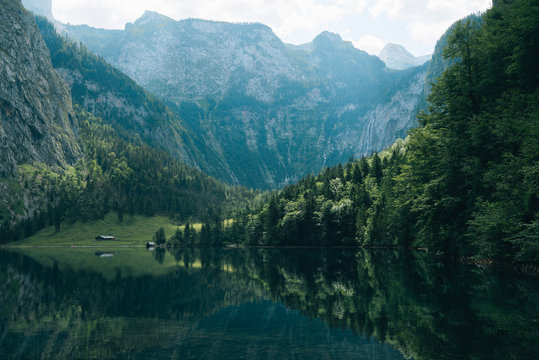 Mountain lake in south Germany with forest and reflection